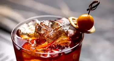 Refreshing Cocktail with Ice Garnished with Dried Lemon and Fresh Fruit