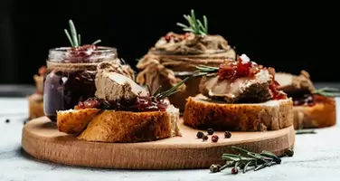 Gourmet Duck Liver Pâté Paired with Red Onion Jam and Assorted Bruschetta