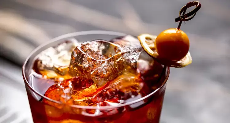 Refreshing Cocktail with Ice Garnished with Dried Lemon and Fresh Fruit